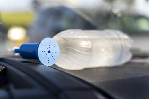 Ultralight Shower to Go product attached to a standard water bottle.