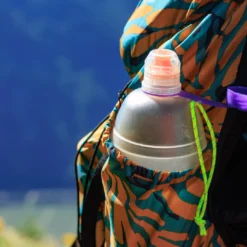 28mm Sport Cap Orange on CNOC collapsable bottle in hiker's pack